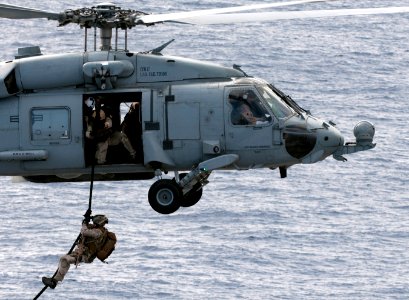 US Navy 110606-N-DR144-114 Explosive Ordnance Disposal personnel fastrope from an HH-60H Sea Hawk helicopter assigned to Helicopter Anti-submarine