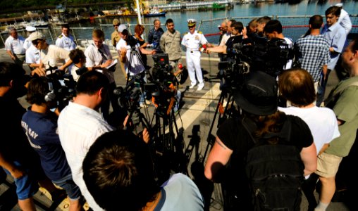 US Navy 110607-N-NW827-048 Capt. John Dorey, commanding officer of the guided-missile cruiser USS Anzio (CG 68), conducts a press conference with U