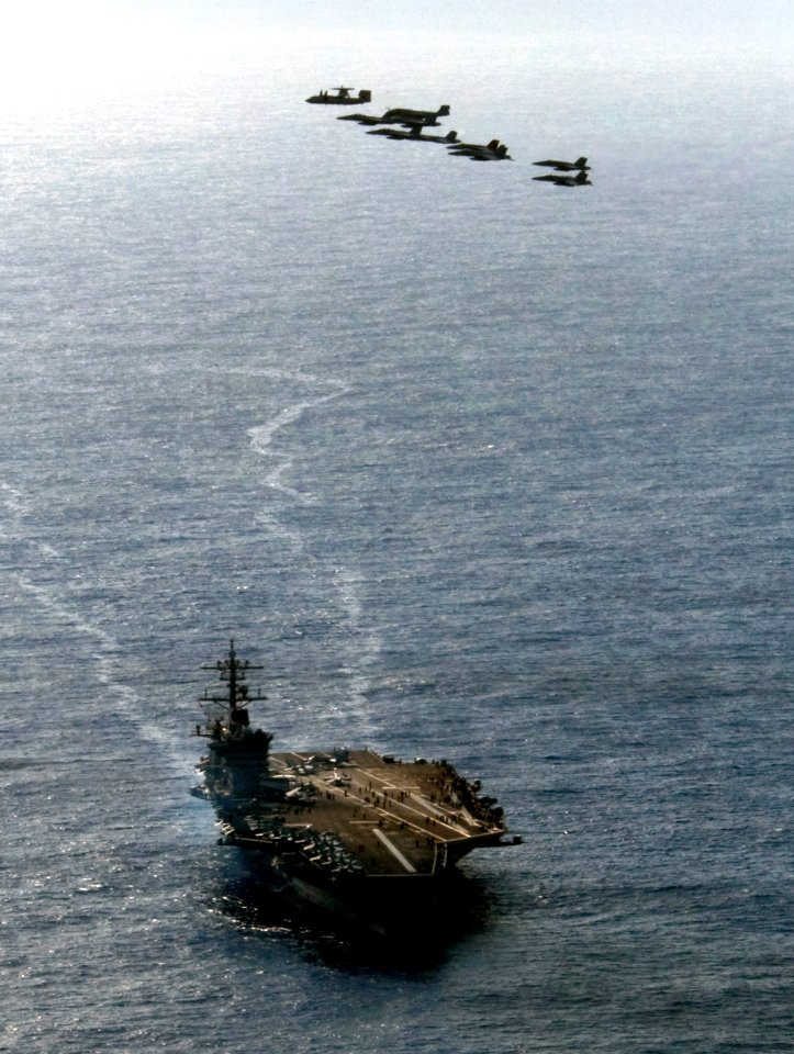 US Navy 110606-N-GZ277-259 A formation of aircraft assigned to Carrier Air Wing (CVW) 17 fly over Nimitz-class aircraft carrier USS Carl Vinson (CV
