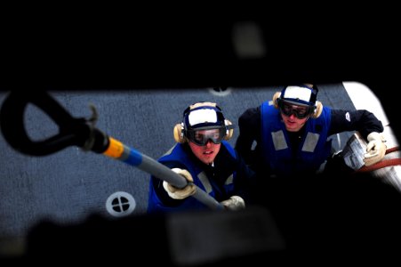 US Navy 110609-N-OI955-296 Sailors assigned to the Military Sealift Command fleet replenishment oiler USNS Guadalupe (T-AO 200) attach cargo to an
