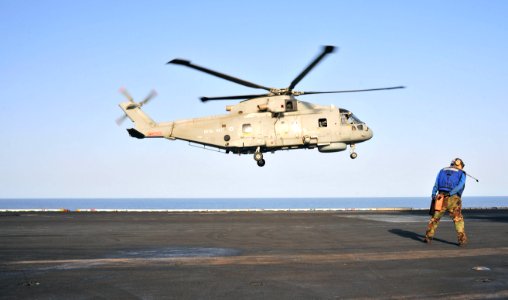 US Navy 110606-N-OP638-047 A Royal Navy Merlin HM MK 1 helicopter carrying a medically evacuated sailor from the German-flagged motor vessel Baltic