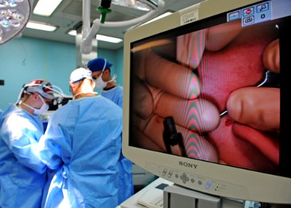US Navy 110608-N-NY820-058 Doctors remove a bullet from a 23-year-old Colombian woman's cheek during a Continuing Promise 2011 medical community se