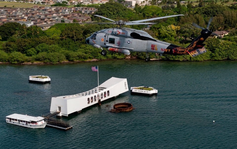 US Navy 110610-N-DR144-218 An SH-60F Sea Hawk helicopter assigned to Helicopter Anti-Submarine Squadron (HS) 15 flies over the USS Arizona Memorial