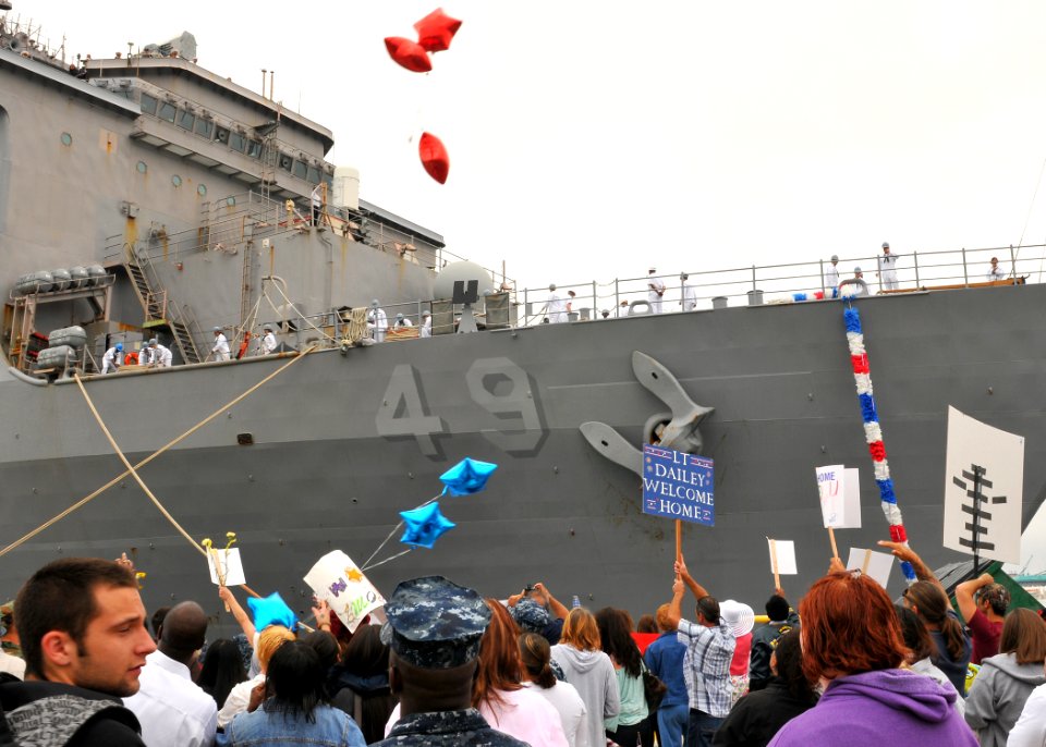 US Navy 110610-N-ZZ999-191 Friends and family members gather near the amphibious dock landing ship USS Harpers Ferry (LSD 49) as the ship moors at