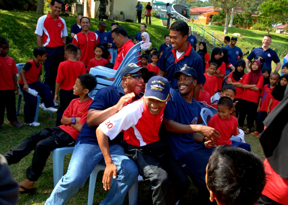 US Navy 110607-N-NJ145-074 Malaysian and U.S. Navy Sailors play musical chairs with children from the Rumah Kanak Orphanage during a Cooperation Af