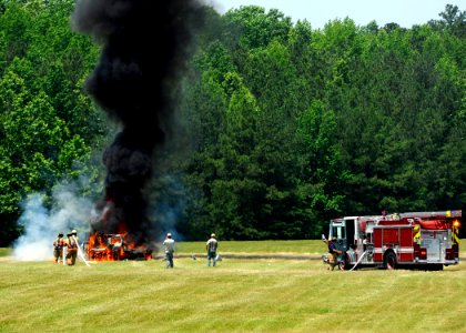 US Navy 110607-N-ZZ999-062 Navy firefighting personnel put out a vehicle fire after an improvised explosive device was detonated during a joint tra