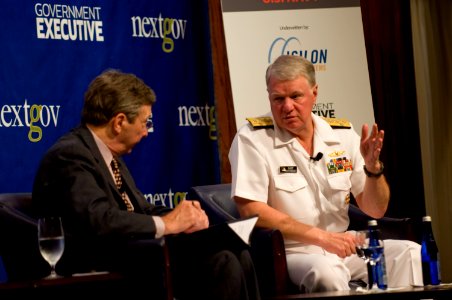 US Navy 110609-N-ZB612-083 Chief of Naval Operations (CNO) Adm. Gary Roughead speaks to Tim Clark during the Government Executive Leadership Breakf