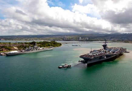 US Navy 110610-N-DR144-786 The Nimitz-class aircraft carrier USS Carl Vinson (CVN 70) is tugged past the USS Arizona Memorial and USS Missouri Muse