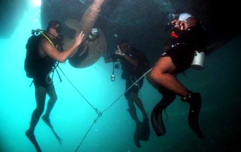 US Navy 110609-N-XD935-314 Navy Diver 3rd Class Bryan Myers, assigned to Mobile Diving and Salvage Unit (MDSU) 2, left, gives the OK sign to Ordina