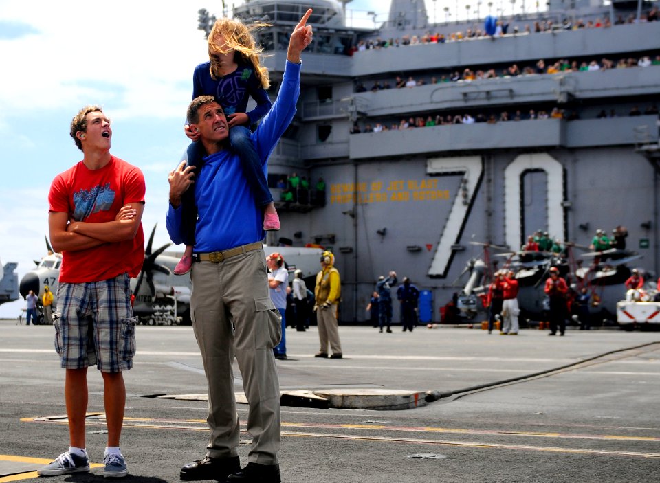 US Navy 110611-N-OK922-552 Executive Officer Cmdr. Putnam H. Browne and his sponsored tiger cruise participants watch the ship's tiger cruise air s