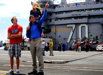 US Navy 110611-N-OK922-552 Executive Officer Cmdr. Putnam H. Browne and his sponsored tiger cruise participants watch the ship's tiger cruise air s