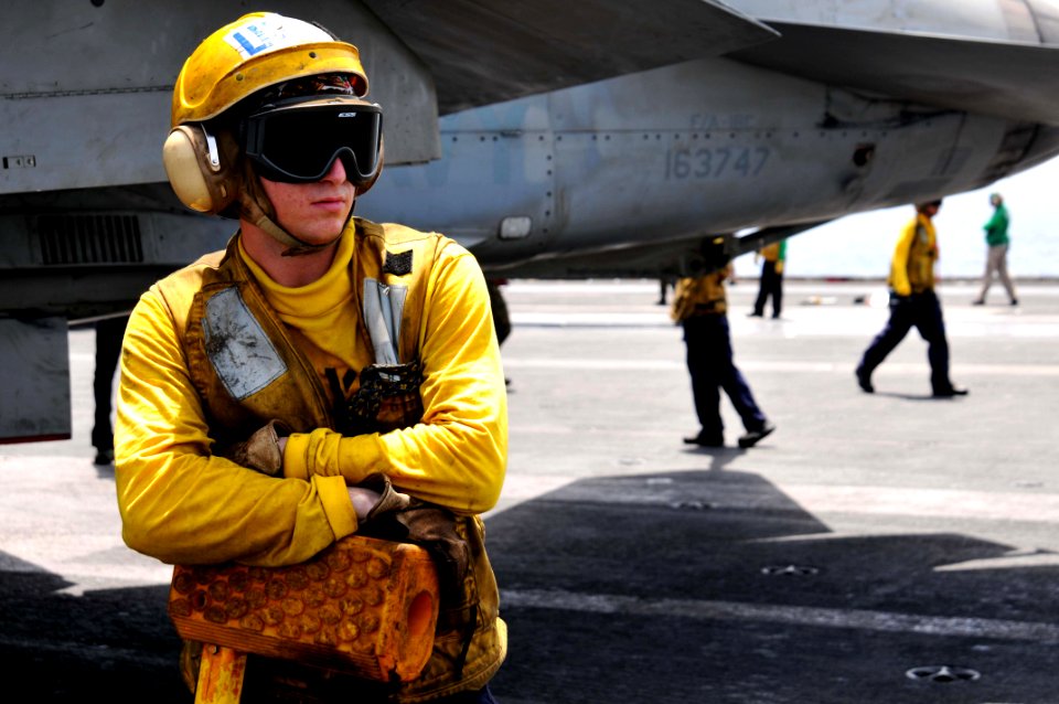 US Navy 110608-N-GL340-069 Aviation Boatswain's Mate Airman Tyler Randrup, from Fresno, Calif., prepares to chalk an aircraft on the flight deck of