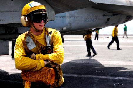 US Navy 110608-N-GL340-069 Aviation Boatswain's Mate Airman Tyler Randrup, from Fresno, Calif., prepares to chalk an aircraft on the flight deck of