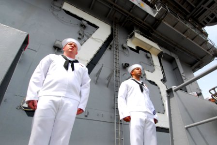 US Navy 110612-N-AW206-024 Sailors assigned to the aircraft carrier USS George Washington (CVN 73) and Carrier Air Wing (CVW) 5 man the rails as th