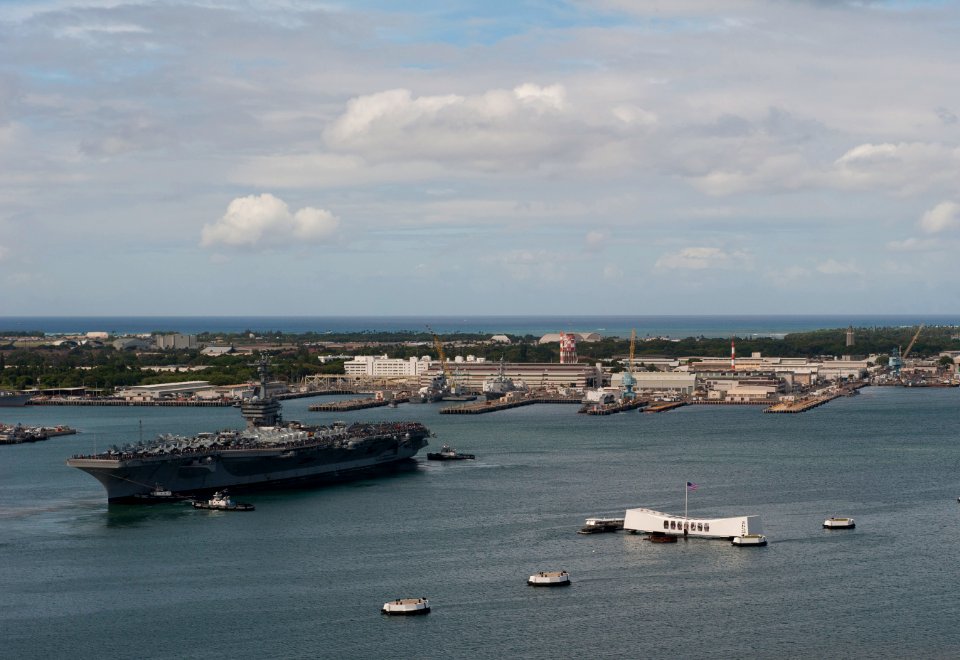 US Navy 110610-N-DR144-573 The Nimitz-class aircraft carrier USS Carl Vinson (CVN 70) is tugged past the USS Arizona Memorial