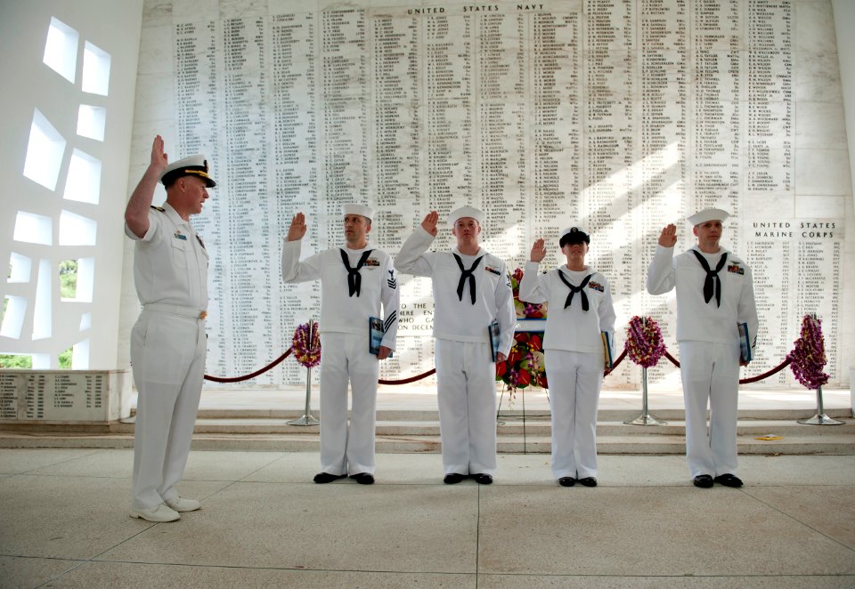 US Navy 110609-N-DR144-300 Quartermaster 1st Class Reed T. Gonzales, left, Aviation Ordnanceman 3rd Class John C. Anthony, Information Systems Tech