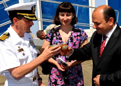 US Navy 110609-N-YM590-130 Capt. John M. Dorey, left, and Robert Chkhaimze toast during a welcoming ceremony for USS Anzio (CG 68)
