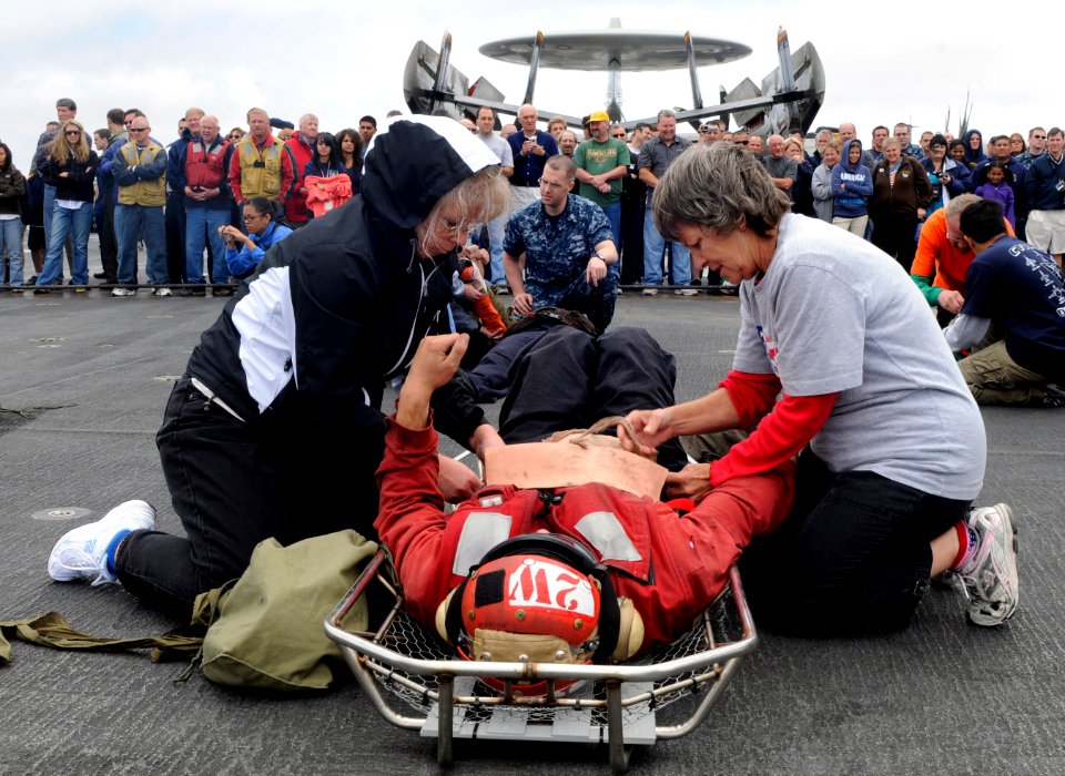 US Navy 110613-N-GZ277-146 Sailors, friends and family participate in a flight deck firefighting demonstration during a tiger cruise aboard USS Car