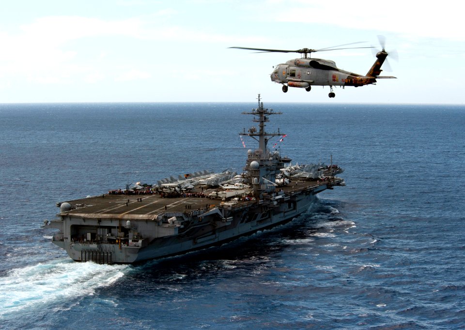 US Navy 110610-N-DR144-389 An SH-60F Sea Hawk helicopter assigned to Helicopter Anti-submarine Squadron (HS) 15 flies over the Nimitz-class aircraf