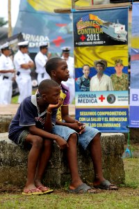 US Navy 110610-F-ET173-148 Children watch the Continuing Promise 2011 closing ceremony in Tumaco, Colombia photo