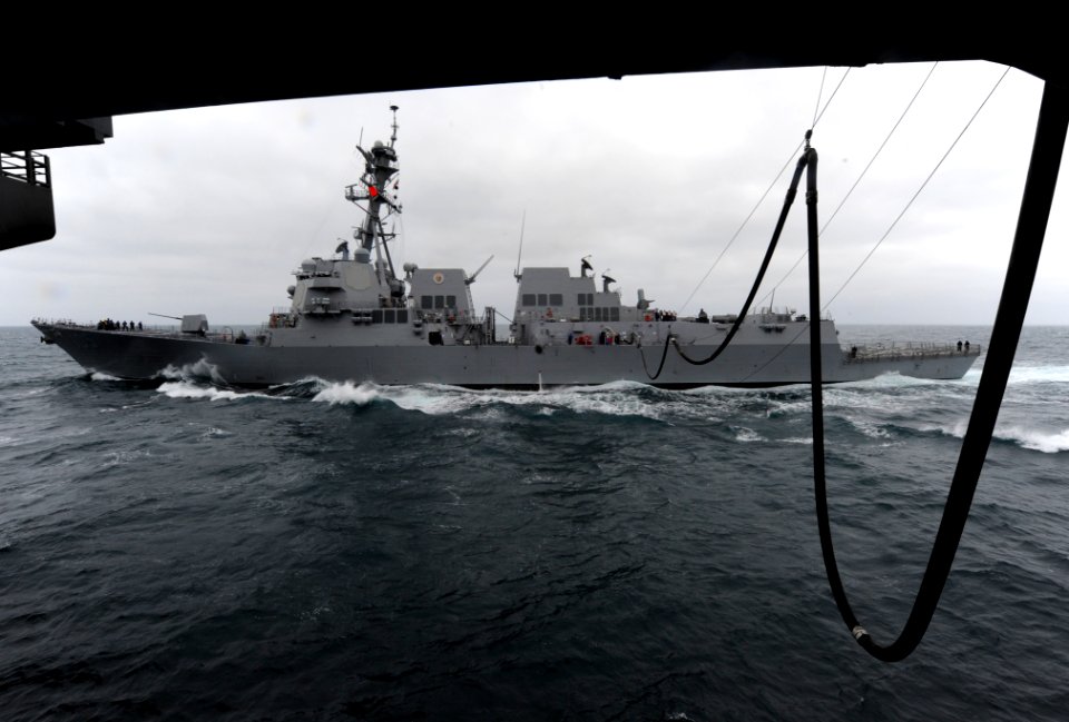 US Navy 110609-N-ZQ631-005 The Arleigh Burke-class guided-missile destroyer USS Dewey (DDG 105) refuels alongside the aircraft carrier USS John C