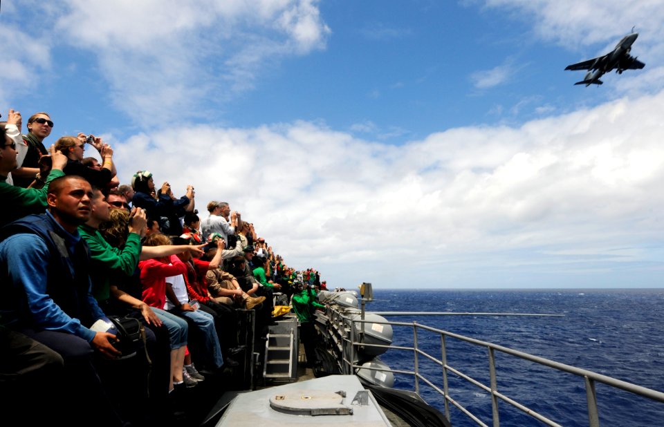 US Navy 110611-N-GZ277-175 Sailors, friends and family watch an EA-6B Prowler assigned to Electronic Attack Squadron (VAQ) 134 during a tiger cruis