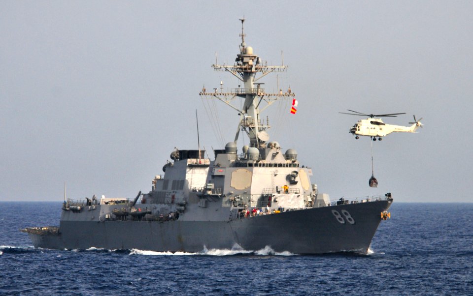 US Navy 110612-N-ZS026-345 An 330EV Puma helicopter lowers a pallet of supplies onto the bow of the guided-missile destroyer USS Preble (DDG 88) du