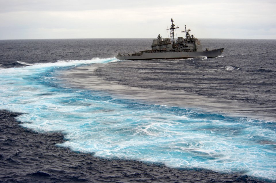 US Navy 110612-N-DR144-351 The Ticonderoga-class guided-missile cruiser USS Bunker Hill (CG 52) breaks away from the Nimitz-class aircraft carrier