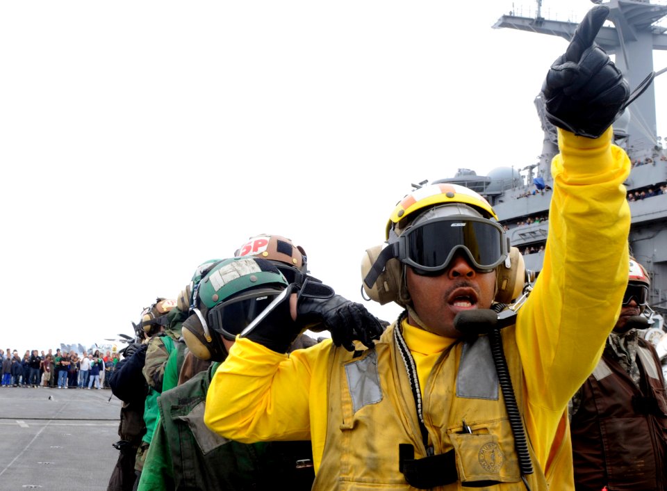 US Navy 110613-N-GZ277-099 Chief Aviation Boatswain's Mate (Handling) Shaven Savoy participates in a flight deck firefighting demonstration aboard