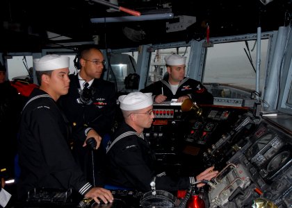 US Navy 110610-N-ZI300-056 Sailors stand the navigation safety team as the guided-missile frigate USS Boone (FFG 28) arrives in Talcahuano, Chile photo