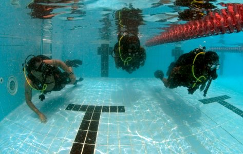 US Navy 110613-N-OT964-104 Chief Navy Diver Aaron Knight, left, assigned to Commander, Task Group (CTG) 56.1,