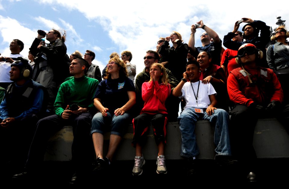 US Navy 110611-N-GZ277-234 Sailors, friends and family watch a tiger cruise air show aboard the Nimitz-class aircraft carrier USS Carl Vinson (CVN