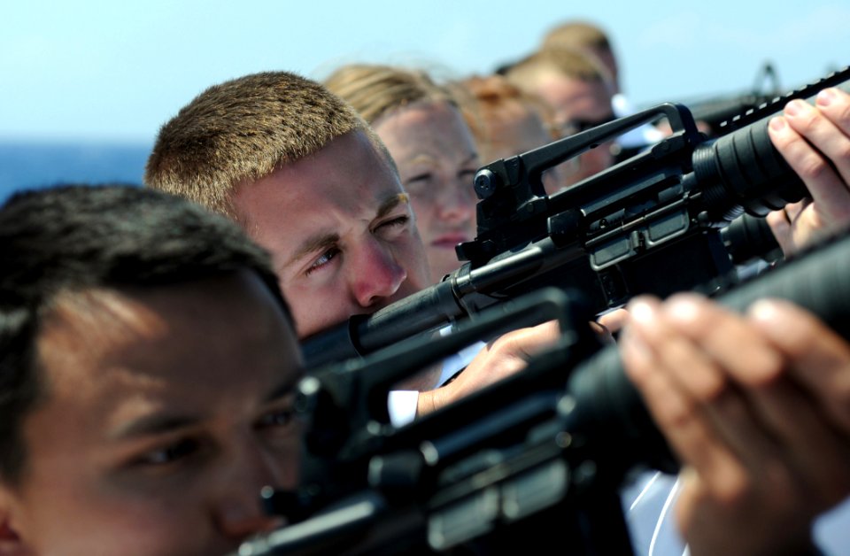 US Navy 110613-N-TB177-314 Sailors prepare to fire a gun salute during a burial at sea rehearsal aboard the guided-missile destroyer USS Truxtun (D