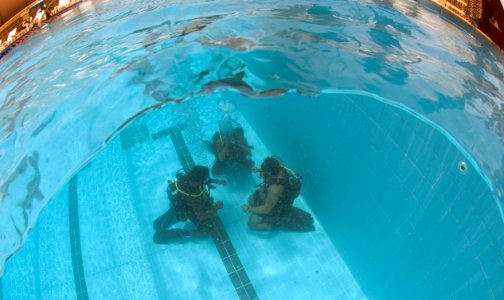 US Navy 110613-N-OT964-118 Chief Navy Diver Aaron Knight, right, assigned to Commander, Task Group (CTG) 56.1, and Pakistani divers