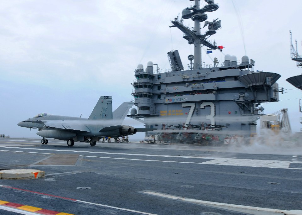 US Navy 110613-N-DS193-013 An F-A-18E Super Hornet assigned to the Eagles of Strike Fighter Squadron (VFA) 115 conducts a touch-and-go landing aboa