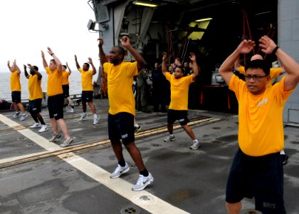 US Navy 110613-N-KB052-101 Sailors conduct physical fitness training on the flight deck of the Ticonderoga-class guided-missile cruiser USS Cowpens