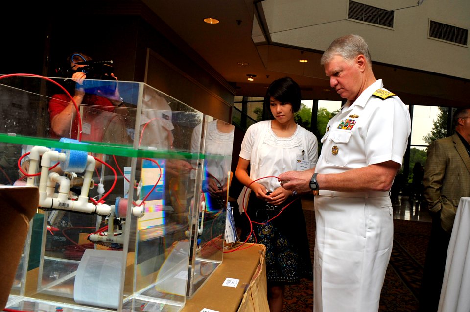 US Navy 110616-N-ZB612-003 Grace Magdamo, from Watkins Mill High School, shows Chief of Naval Operations (CNO) Adm. Gary Roughead