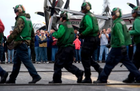 US Navy 110613-N-DR144-121 Sailors, friends and family watch as flight deck personnel demonstrate aircraft firefighting drills on the flight deck o
