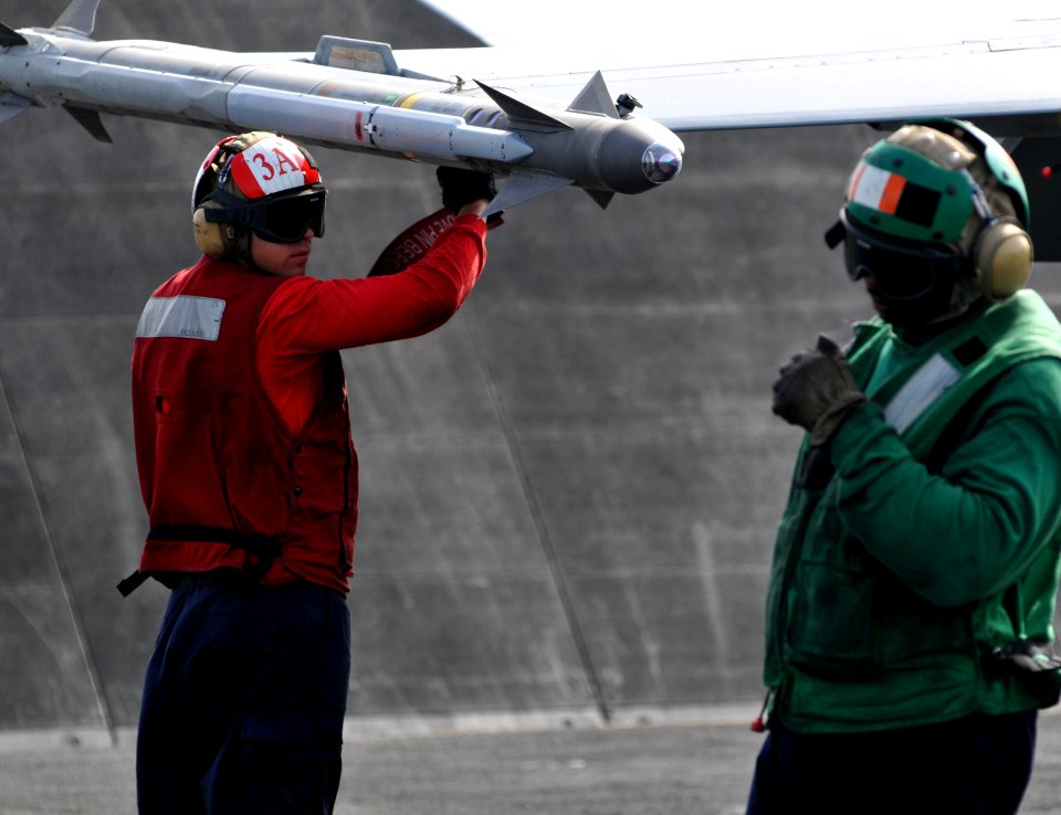 US Navy 110613-N-GL340-122 Aviation Ordnanceman 3rd Class Garrett Hazelwood checks the ordnance on an aircraft before it catapults from USS Ronald