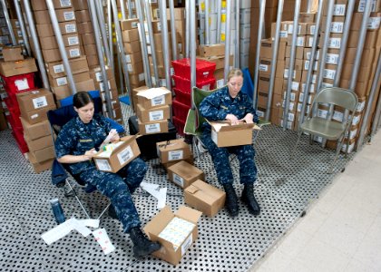 US Navy 110615-F-ET173-053 Lt. Meaghan Christopher, left, from Akron, Ohio, and Lt. Rachel Ackerman, from Deerfield Beach, Fla., label medication i