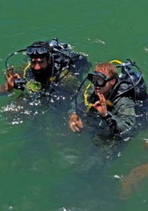 US Navy 110615-N-OT964-323 Chief Navy Diver Ryan Oakley, right, assigned to Commander, Task Group (CTG) 56.1, and a Pakistan Navy diver give an OK