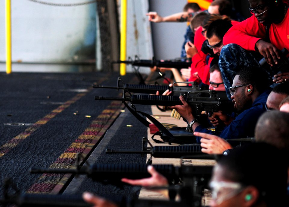 US Navy 110617-N-SB672-209 Sailors aboard the aircraft carrier USS Ronald Reagan (CVN 76) fire M-16 service rifles during a small arms qualificatio