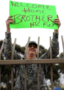 US Navy 110615-N-PB383-097 Spc. Josh Horton welcomes his brother, Hull Maintenance Technician 2nd Class Brandon Key, home from deployment aboard th