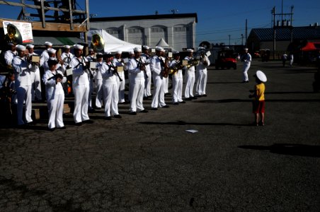US Navy 110615-N-CI293-483 A child at the Sturgis on the River Motorcycle Rally leads the U.S. Navy Band Great Lakes, Ceremonial Band