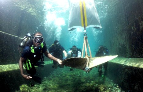 US Navy 110615-N-XD935-086 Barbados Coast Guard Chief Austin Rickey Howell and a team of multinational divers use a lift bag system to move a sunke