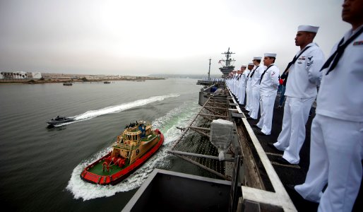 US Navy 110615-N-TU221-216 Sailors man the rails as the Nimitz-class aircraft carrier USS Carl Vinson (CVN 70) returns to homeport at Naval Base Co