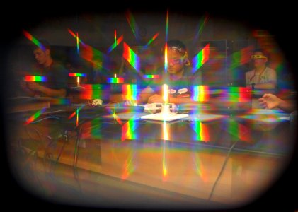 US Navy 110615-N-OA833-002 Seen through the lens of light-diffracting glasses, students participating in the annual Science, Technology, Engineerin