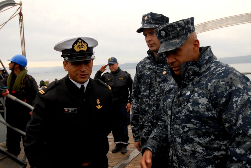 US Navy 110614-N-ZI300-016 Cmdr. Roy Love, commanding officer of the guided-missile frigate USS Boone (FFG 28) is greeted by senior leadership of t