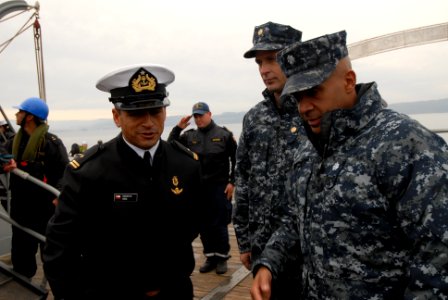 US Navy 110614-N-ZI300-016 Cmdr. Roy Love, commanding officer of the guided-missile frigate USS Boone (FFG 28) is greeted by senior leadership of t photo