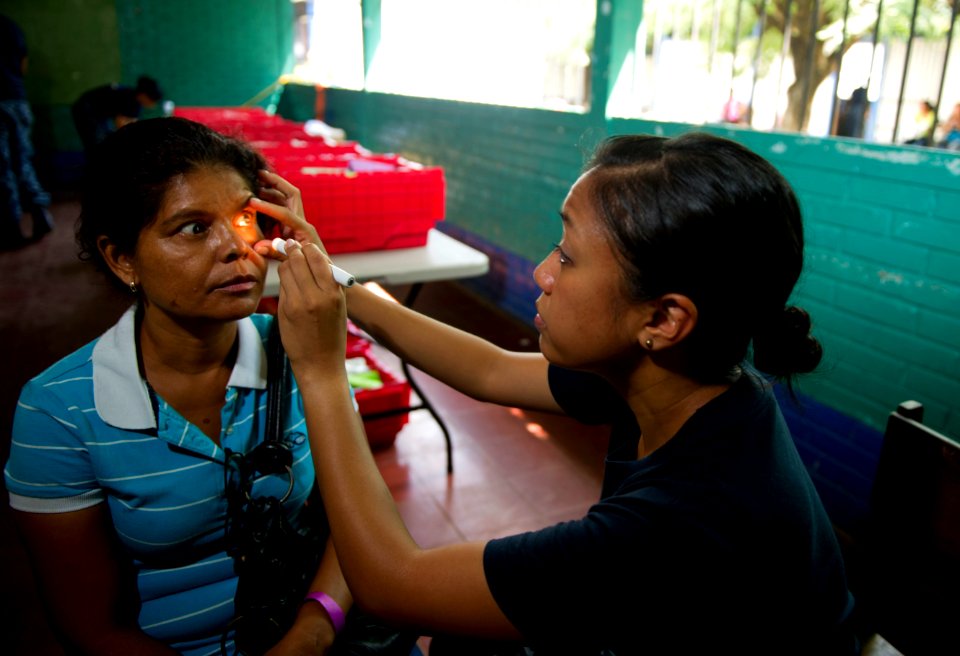US Navy 110619-N-RM525-137 Lt. Patricia Salazar, from San Francisco, examines a patient at the Escuela Humberto Mendez Juarez medical site during a